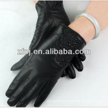 Ladies black mid-length hand gloves driving of a car